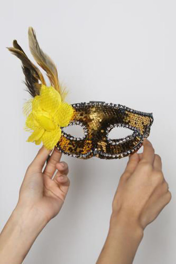 Picture of Elegant yellow mask decorated with shiny feathers and beads, ideal for parties and luxury occasions