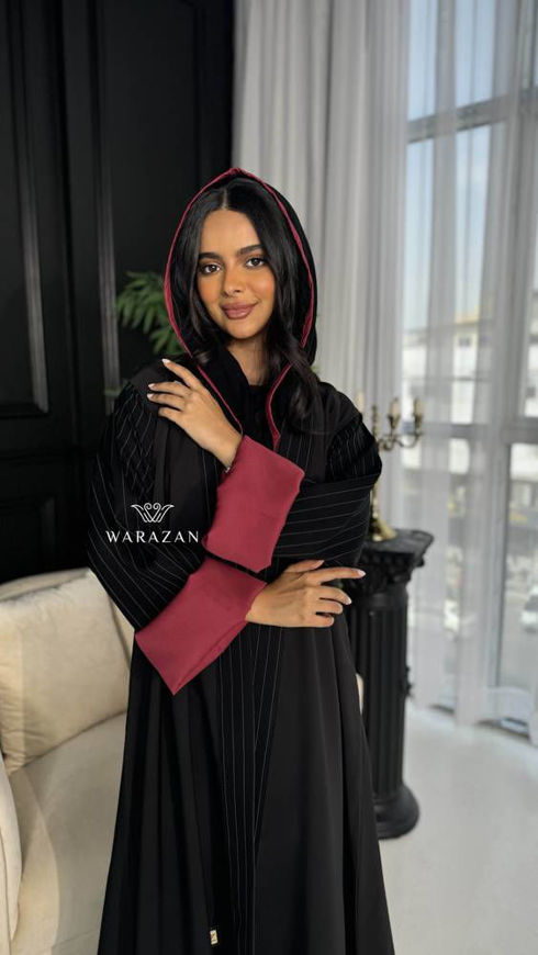 Picture of Black striped abaya with an exotic color nude